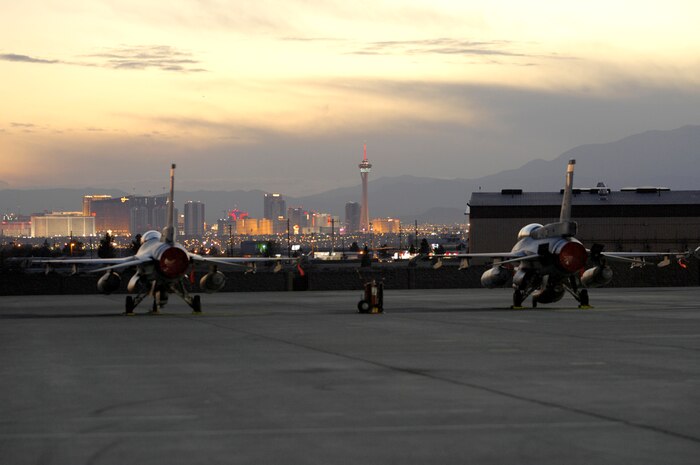 NELLIS AIR FORCE BASE, Nev.—Two F-16 Falcons from the Republic of Singapore air force, 425th Aircraft Maintenance Unit, Luke AFB, Ariz., sit on the flightline before a mission here, Jan. 23. The Republic of Singapore air force is currently at Nellis participating in Red Flag 8-2.1, which is a multi-national exercise training pilots in the world’s most realistic combat scenarios. The experience gained during the exercise is vital to the survival of pilots in combat. The unit is assigned to Luke AFB for specialized training on their F-16 aircraft they can only receive in the U.S. (U.S. Air Force photo by Master Sgt Robert W. Valenca)