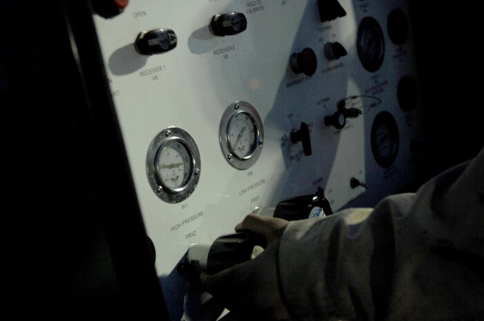 NELLIS AIR FORCE BASE, Nev.—Airmen Apprentice Dmitriy Tkachenko, 134th Electronic Attack Squadron, Naval Air Station Whidbey Island, Wash., adjusts the nitrogen pressure flowing to his EA-6B Prowler before a night mission here Jan. 23.  Airmen Gonzalez is at Nellis with his unit participating in Red Flag 8-2.1, which is a multi-national exercise training pilots in the world’s most realistic combat scenarios. The experience gained during the exercise is vital to the survival of pilots in combat. (U.S. Air Force photo by Master Sgt Robert W. Valenca)