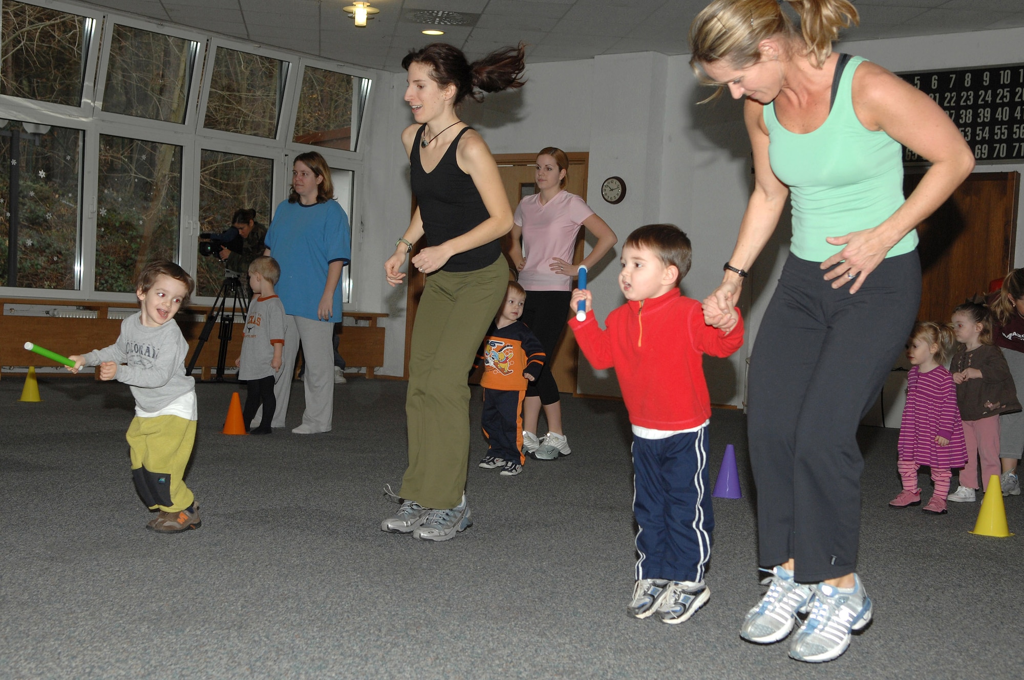 Renee Champagne, (right), does a fitness activity with her son, during the Mommy and Me Yoga and Fitness class, Jan.18, at the Vogelweh Community Center. Ms. Champagne is the instructor for the class. (U.S. Air Force photo/Senior Airman Megan M. Carrico) 