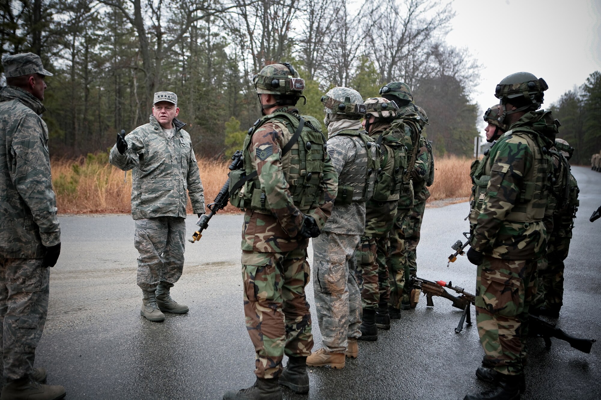 Gen. Arthur Lichte, Air Mobility Command commander, and Chief Master Sgt. Joseph Barron. AMC command chief, talk with security forces students in the U.S. Air Force Expeditionary Center's Phoenix Warrior training course at Naval Air Engineering Station Lakehurst, N.J., during an visit to the Center Jan. 22.  The official visit by the mobility commander provided a full spectrum of the USAF EC's capabilities in training, innovation and facilities.  (U.S. Air Force Photo/Master Sgt. Bob Lorusso)