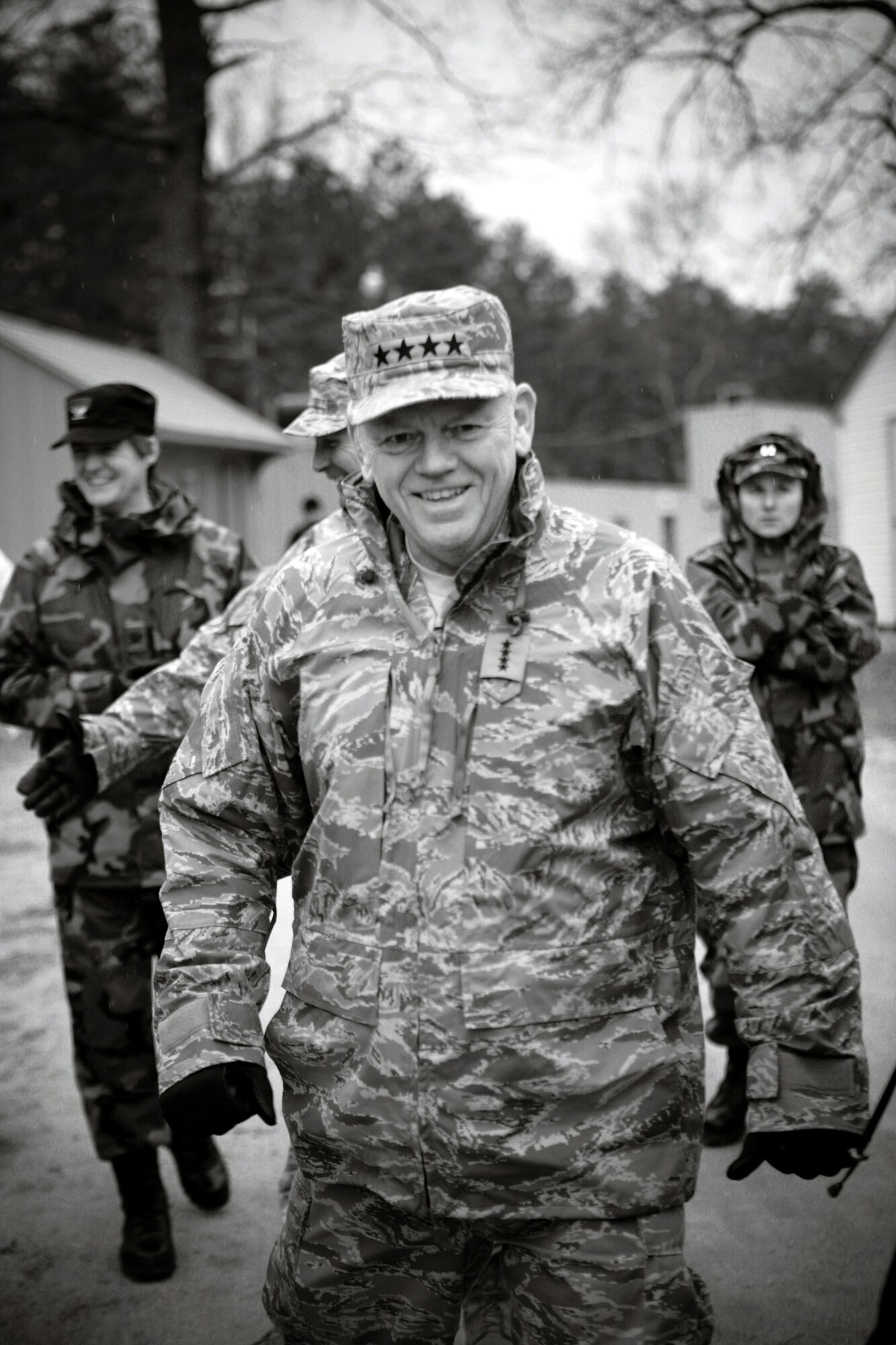 Gen. Arthur Lichte, Air Mobility Command commander from Scott Air Force Base, Ill., and others walk through the fictional village of "Citheron" for Air Force Exercise Eagle Flag during an official visit to the U.S. Air Force Expeditionary Center and Eagle Flag Jan. 22 on Fort Dix and Naval Air Engineering Station Lakehurst, N.J.  The official visit by the mobility commander provided a full spectrum of the USAF EC's capabilities in training, innovation and facilities. (U.S. Air Force Photo/Master Sgt. Bob Lorusso)