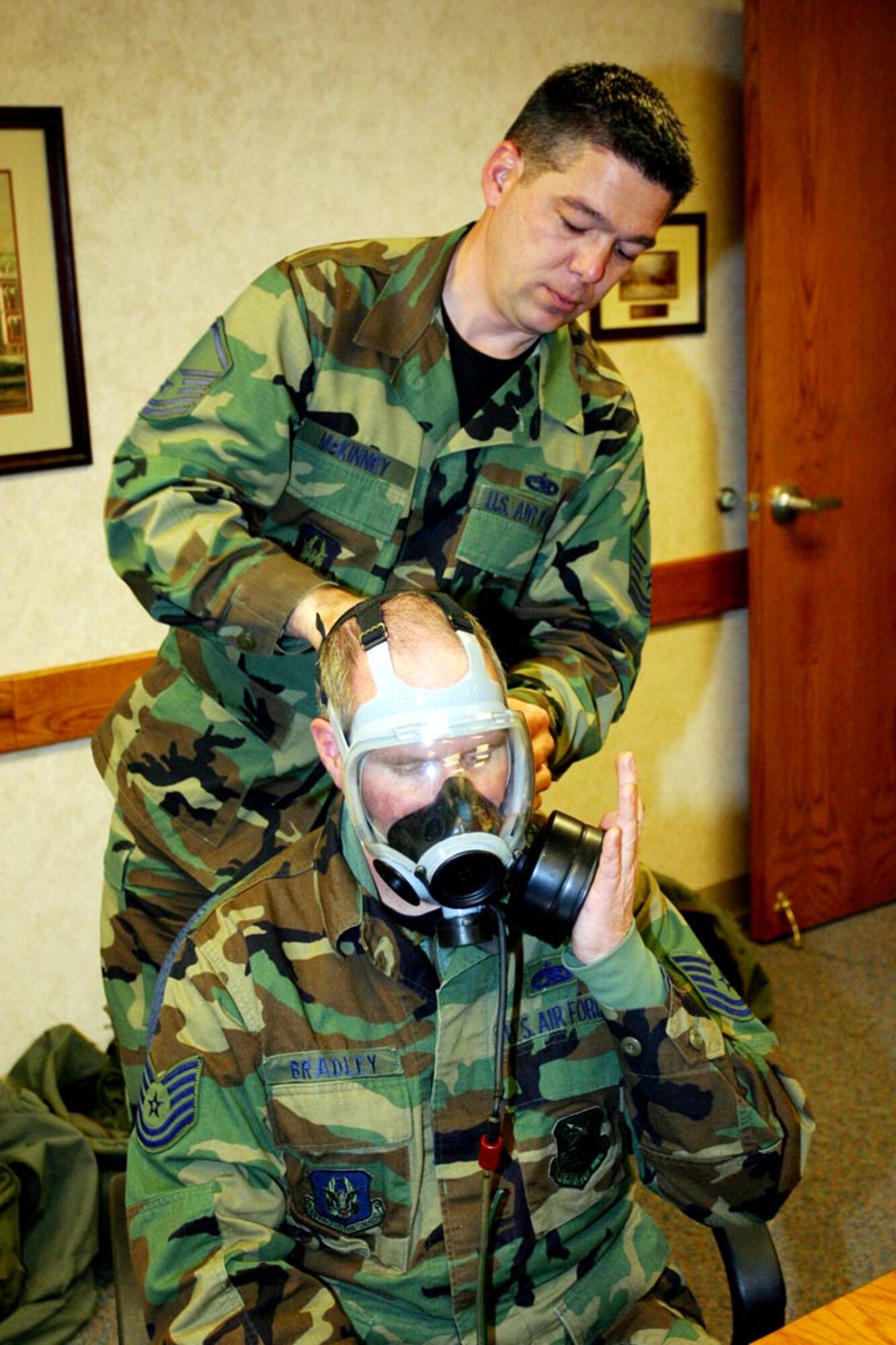 Master Sgt. Doyle McKinney, a 419th Medical Squadron bioenvironmental technician, performs a gas mask fit test on Tech. Sgt. Phil Bradley of the 419th Maintenance Squadron. These fit tests are routinely carried out during the wing's Unit Training Assemblies one weekend per month to maintain deployment readiness. (U.S. Air Force photo/Staff Sgt. Kyle Brasier)