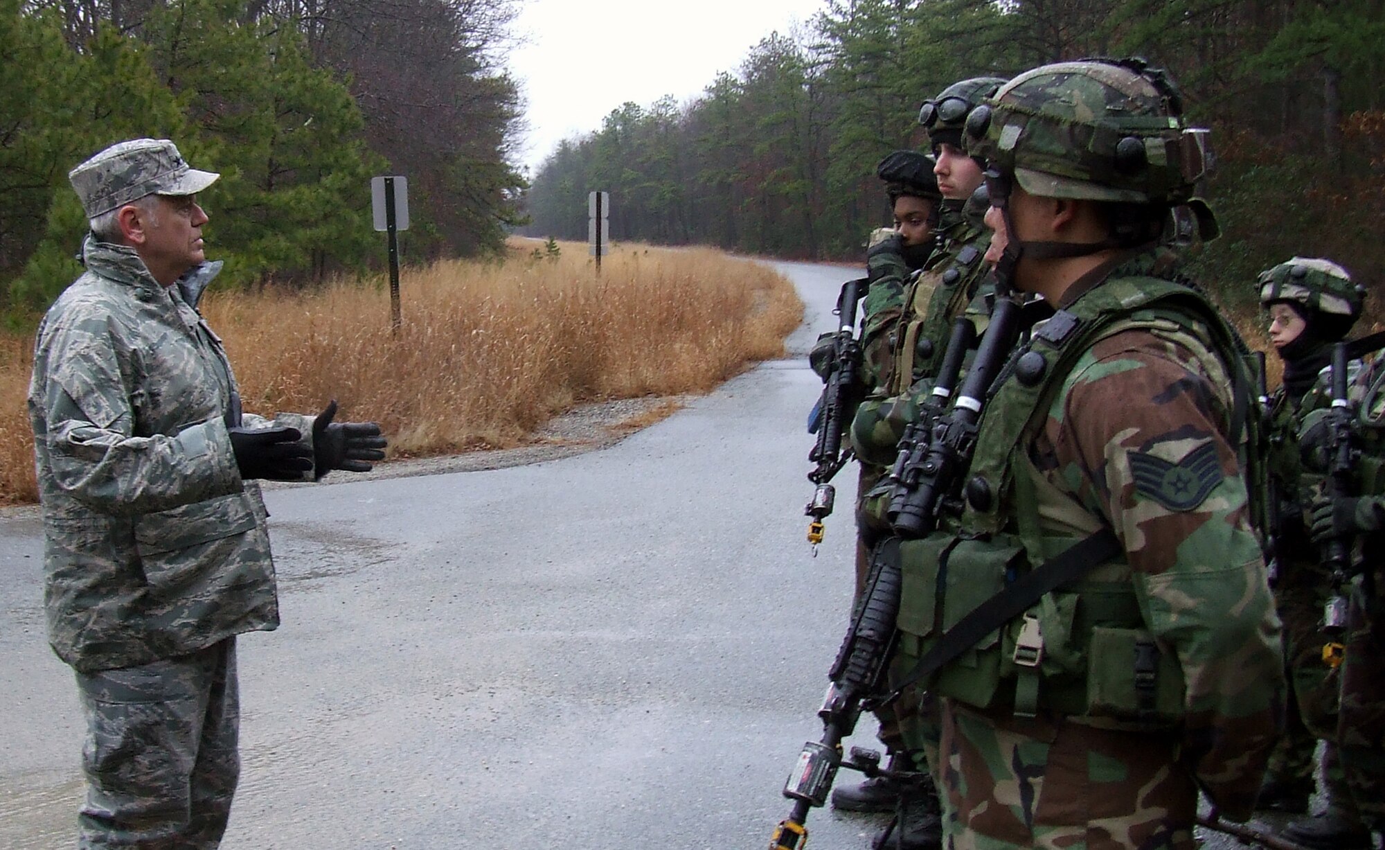 Gen. Arthur Lichte, Air Mobility Command commander, talks with security forces students in the U.S. Air Force Expeditionary Center's Phoenix Warrior training course at Naval Air Engineering Station Lakehurst, N.J., during an visit to the Center Jan. 22.  The official visit by the mobility commander provided a full spectrum of the USAF EC's capabilities in training, innovation and facilities.  (U.S. Air Force Photo/Tech. Sgt. Scott T. Sturkol)