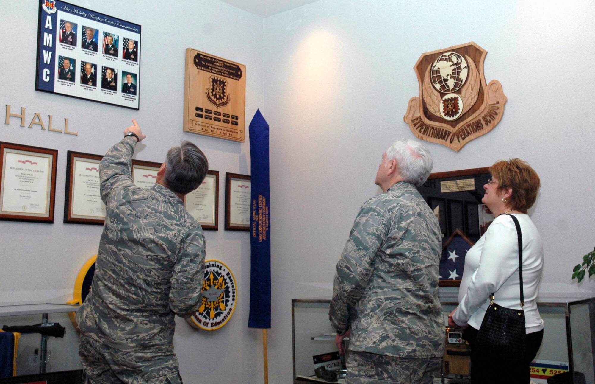 Maj. Gen. Kip Self, U.S. Air Force Expeditionary Center commander, shows Gen. Arthur Lichte, Air Mobility Command commander, and his wife Chris Lichte, one of the heritage areas of the Center during General Lichte's visit to the Center Jan. 22 on Fort Dix, N.J.  Along with the general and his wife, Chief Master Sgt. Joseph Barron, AMC command chief also visited the Center.  The official visit by the mobility commander provided a full spectrum of the USAF EC's capabilities.  (U.S. Air Force Photo/Tech. Sgt. Scott T. Sturkol)
