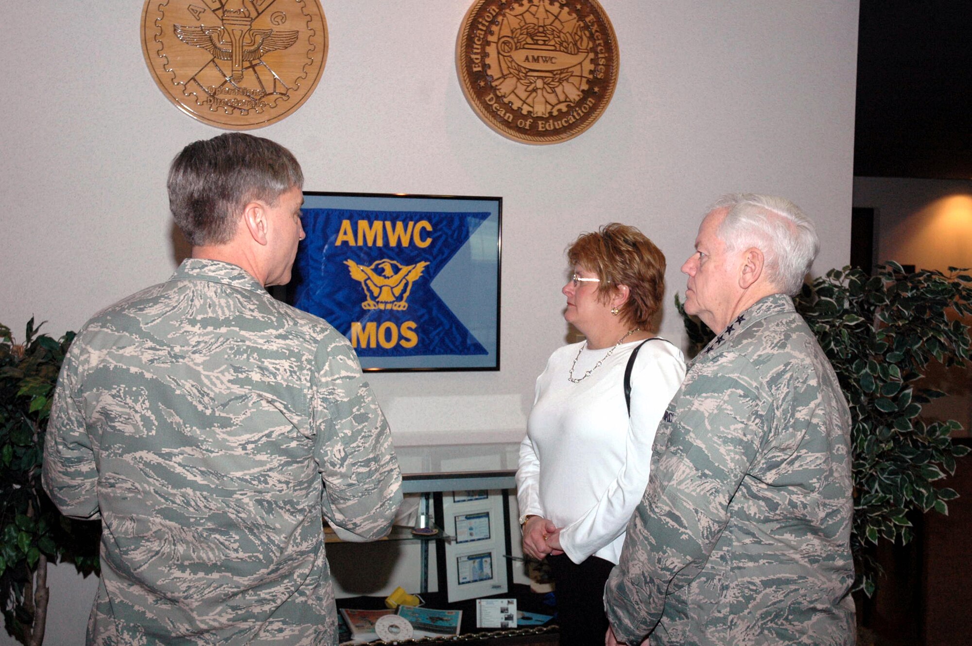 Maj. Gen. Kip Self, U.S. Air Force Expeditionary Center commander, shows Gen. Arthur Lichte, Air Mobility Command commander, and his wife Chris Lichte, one of the heritage areas of the Center during General Lichte's visit to the Center Jan. 22 on Fort Dix, N.J.  Along with the general and his wife, Chief Master Sgt. Joseph Barron, AMC command chief also visited the Center.  The official visit by the mobility commander provided a full spectrum of the USAF EC's capabilities.  (U.S. Air Force Photo/Tech. Sgt. Scott T. Sturkol)