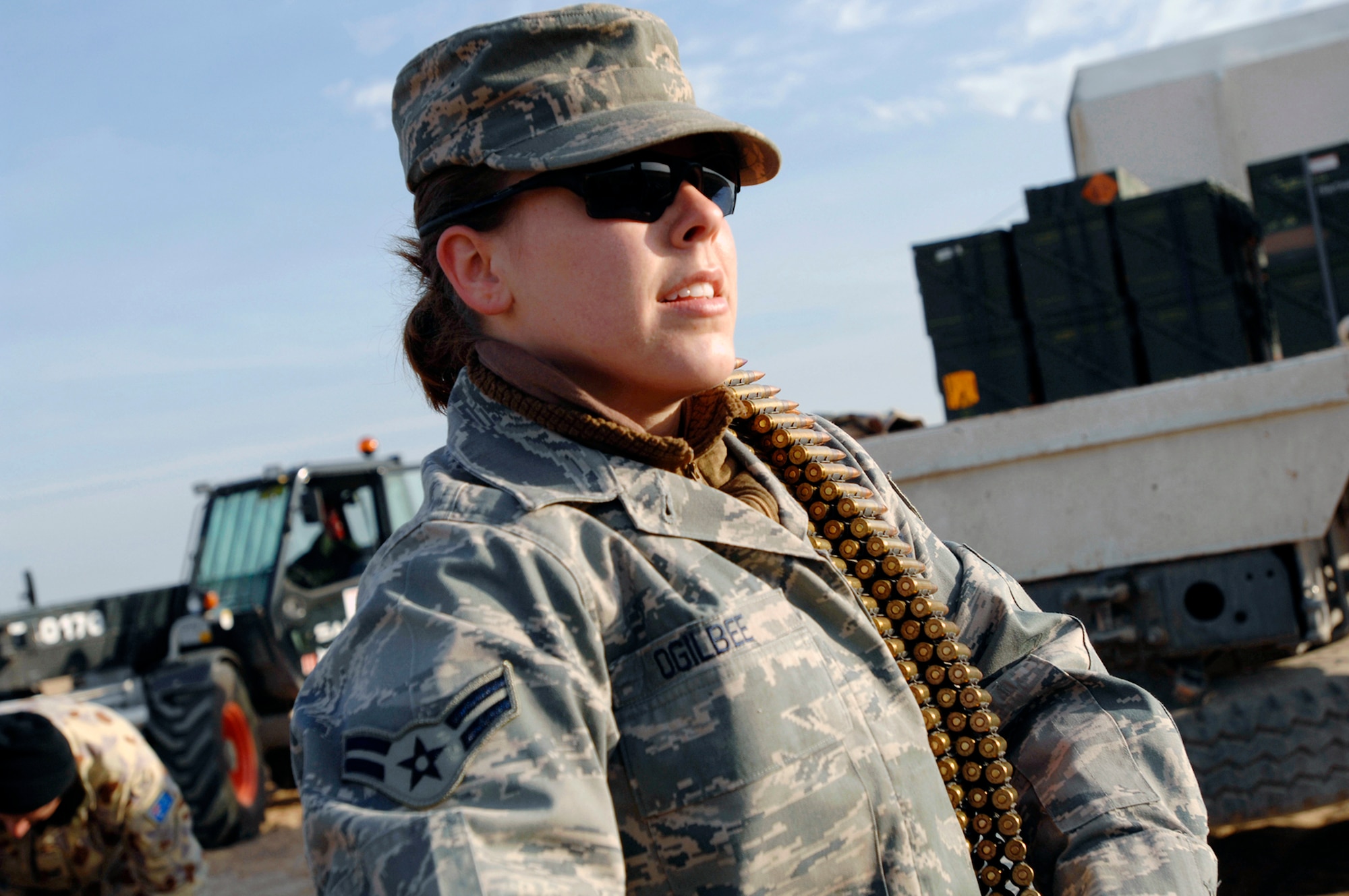 Airman 1st Class Jessica Ogilbee handles ammunition set to be destroyed during a controlled detonation Jan. 18 at an explosive ordnance disposal range in Southwest Asia. The controlled detonation was done in conjunction with coalition forces from the Australian Army Force Level Logistic Asset unit to destroy unserviceable munitions. Airman Ogilbee is with the 386th Expeditionary Civil Engineer Squadron Explosive Ordnance Disposal Flight. (U.S. Air Force photo/Senior Airman Patrick Dixon) 
