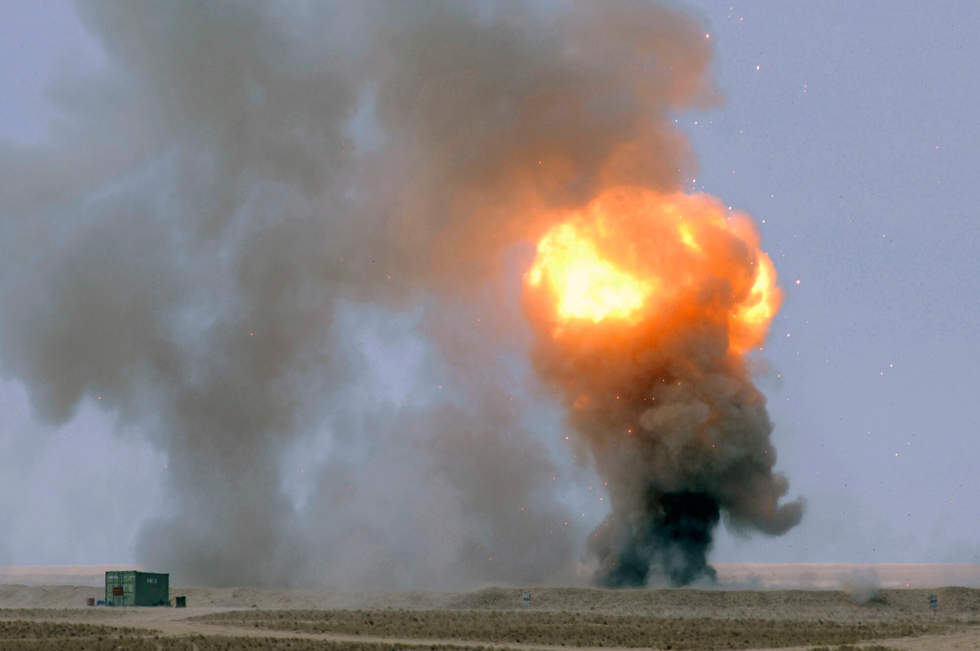 A fire ball rises into the sky during a controlled detonation performed by coalition forces from the Air Force's 386th Expeditionary Civil Engineer Squadron and the Australian Army Force Level Logistic Asset unit Jan. 18 at an explosive ordnance disposal range in Southwest Asia. The controlled detonation is used to destroy unserviceable munitions. (U.S. Air Force photo/Senior Airman Patrick Dixon) 
