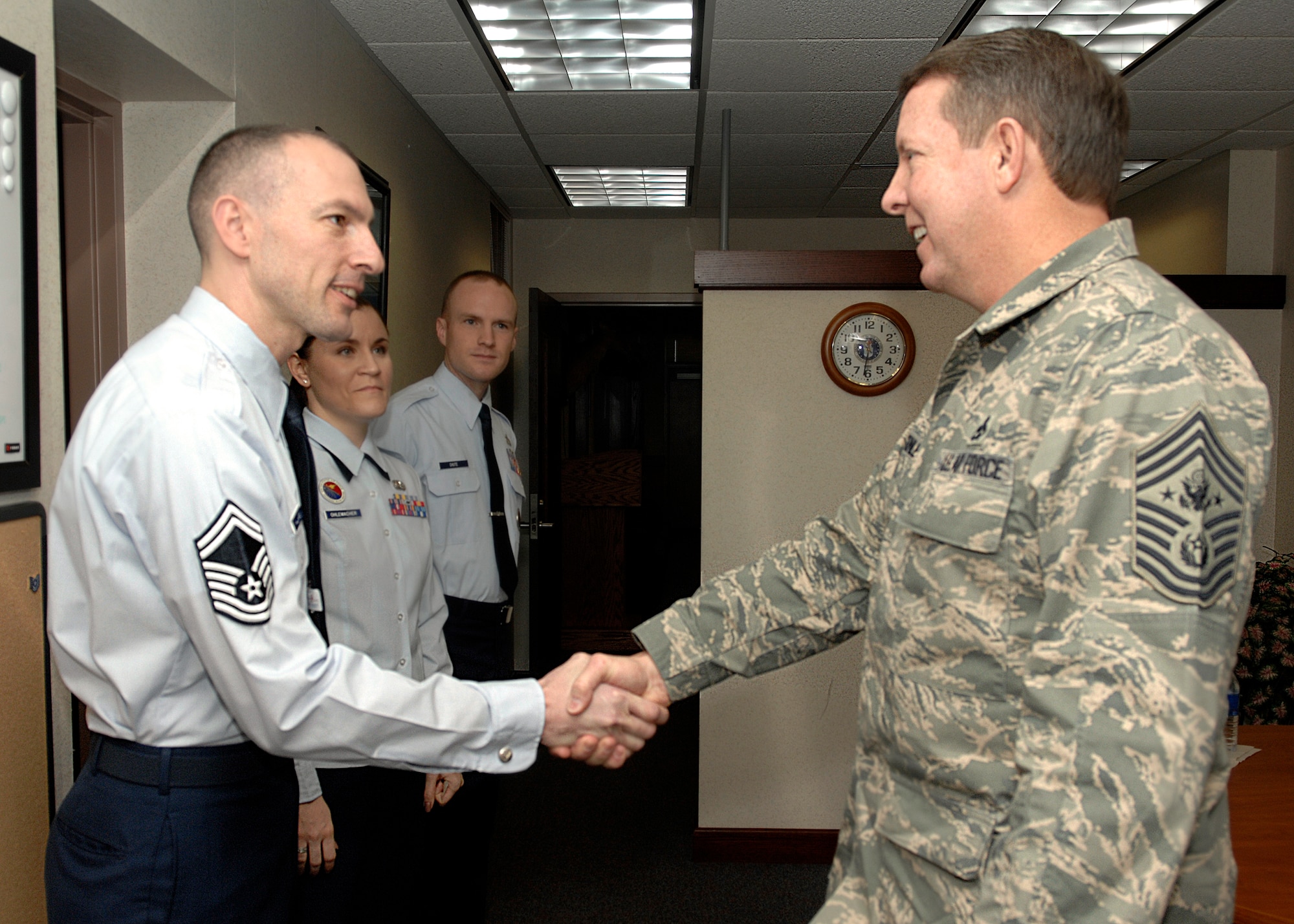 SCOTT AIR FORCE BASE, Ill. -- Chief Master Sergeant of the Air Force Rodney J. McKinley greets Senior Master Sgt. Larry Williams, Tanker Airlift Control Center acting first sergeant, during a visit ot Scott Air Force Base's Bud Andres Airman Leadership School Jan. 18. (Photo by Airman 1st Class Megan Gilliand)