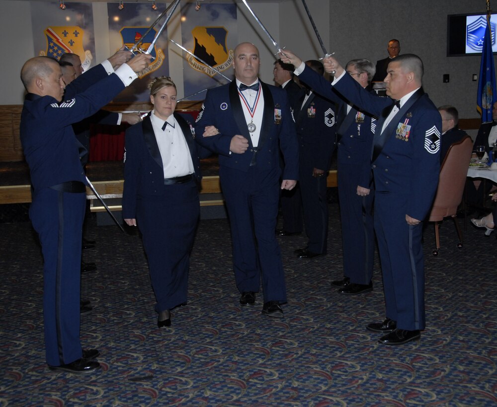 Senior Master Sgt. Michael Nowlin 373rd Training Squadron, and his wife Master Sgt. Terina Nowlin, 82nd Mission Support Squadron, are welcomed into the Sheppard Chief's Group by group members Jan. 18 at the Sheppard Club. (U.S. Air Force photo/Sandy Wassenmiller)