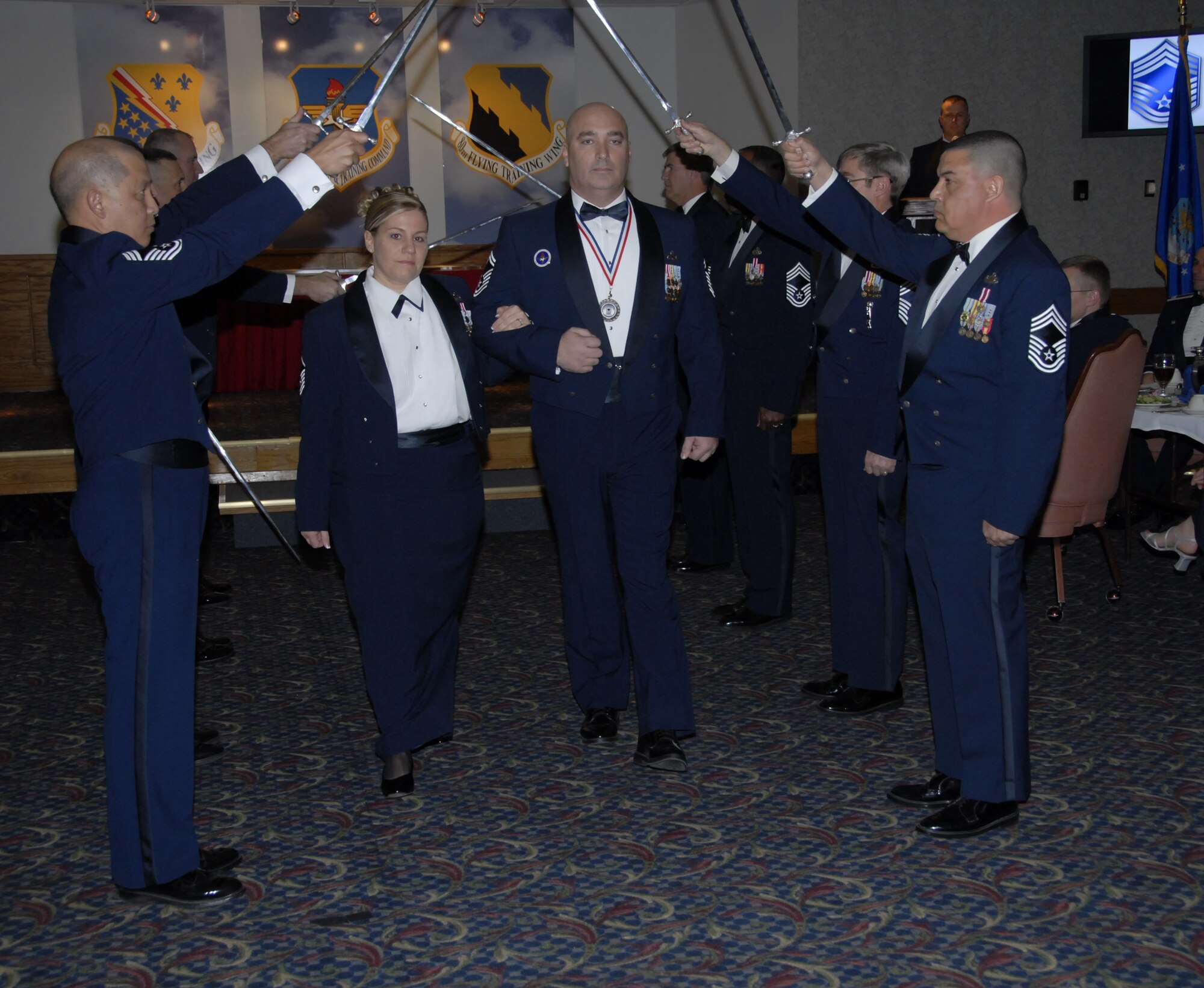Senior Master Sgt. Michael Nowlin 373rd Training Squadron, and his wife Master Sgt. Terina Nowlin, 82nd Mission Support Squadron, are welcomed into the Sheppard Chief's Group by group members Jan. 18 at the Sheppard Club. (U.S. Air Force photo/Sandy Wassenmiller)