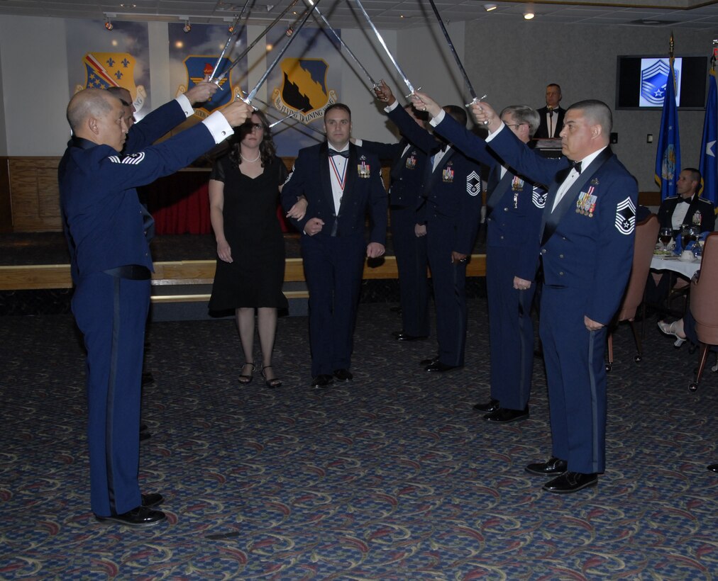 Senior Master Sgt. Benjamin Saunders, 372nd Training Squadron, and his wife are welcomed into the Sheppard Chief's Group by group members Jan. 18 at the Sheppard Club. (U.S. Air Force photo/Sandy Wassenmiller)