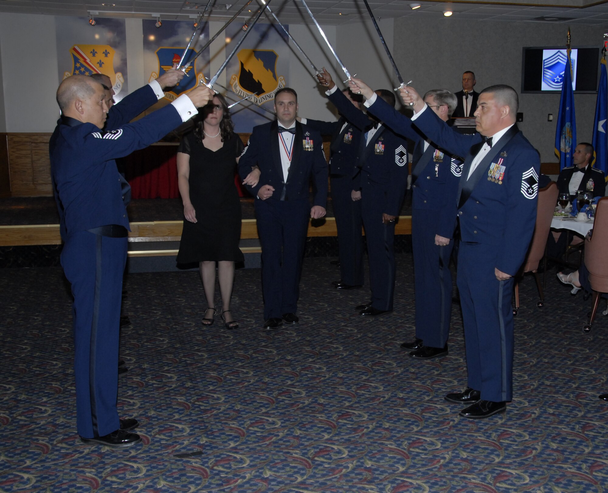 Senior Master Sgt. Benjamin Saunders, 372nd Training Squadron, and his wife are welcomed into the Sheppard Chief's Group by group members Jan. 18 at the Sheppard Club. (U.S. Air Force photo/Sandy Wassenmiller)