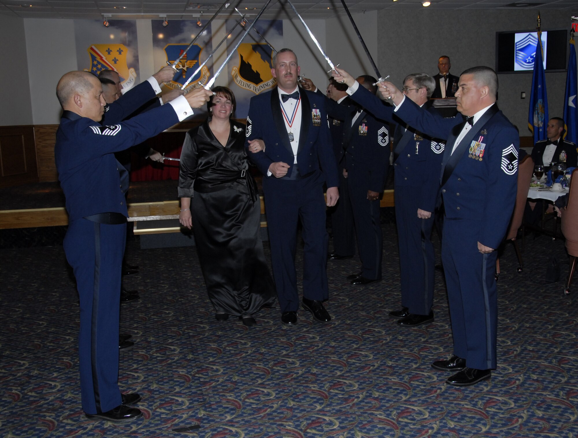 Senior Master Sgt. Jonathan Shane, 82nd Medical Support Squadron and his wife are welcomed into the Sheppard Chief's Group by group members Jan. 18 at the Sheppard Club. (U.S. Air Force photo/Sandy Wassenmiller)