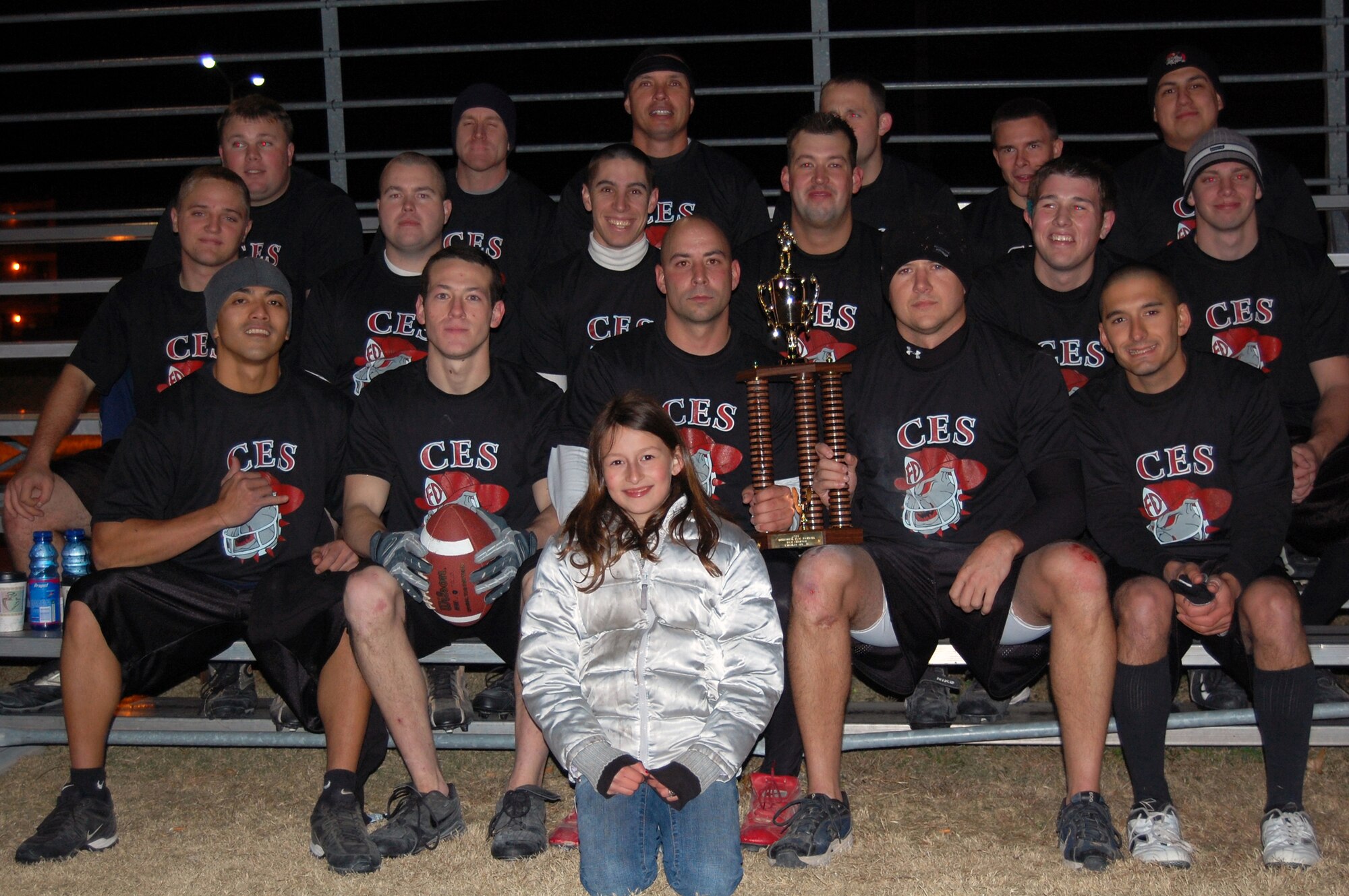 LAUGHLIN AIR FORCE BASE, Texas-- The 47th Civil Engineer Squadron proudly displays their championship trophy Jan. 23.  “This one’s for the commander,” said Staff Sgt. Matthew Hare, 47th CES coach.  “We took a couple steps back midseason, but once we started having fun again we really stepped-up our performance.”  Sergeant Hare and Les McCracken scored the only two touchdowns during the game.  (U.S. photo by 2nd Lt. Courtney Kippenberger)