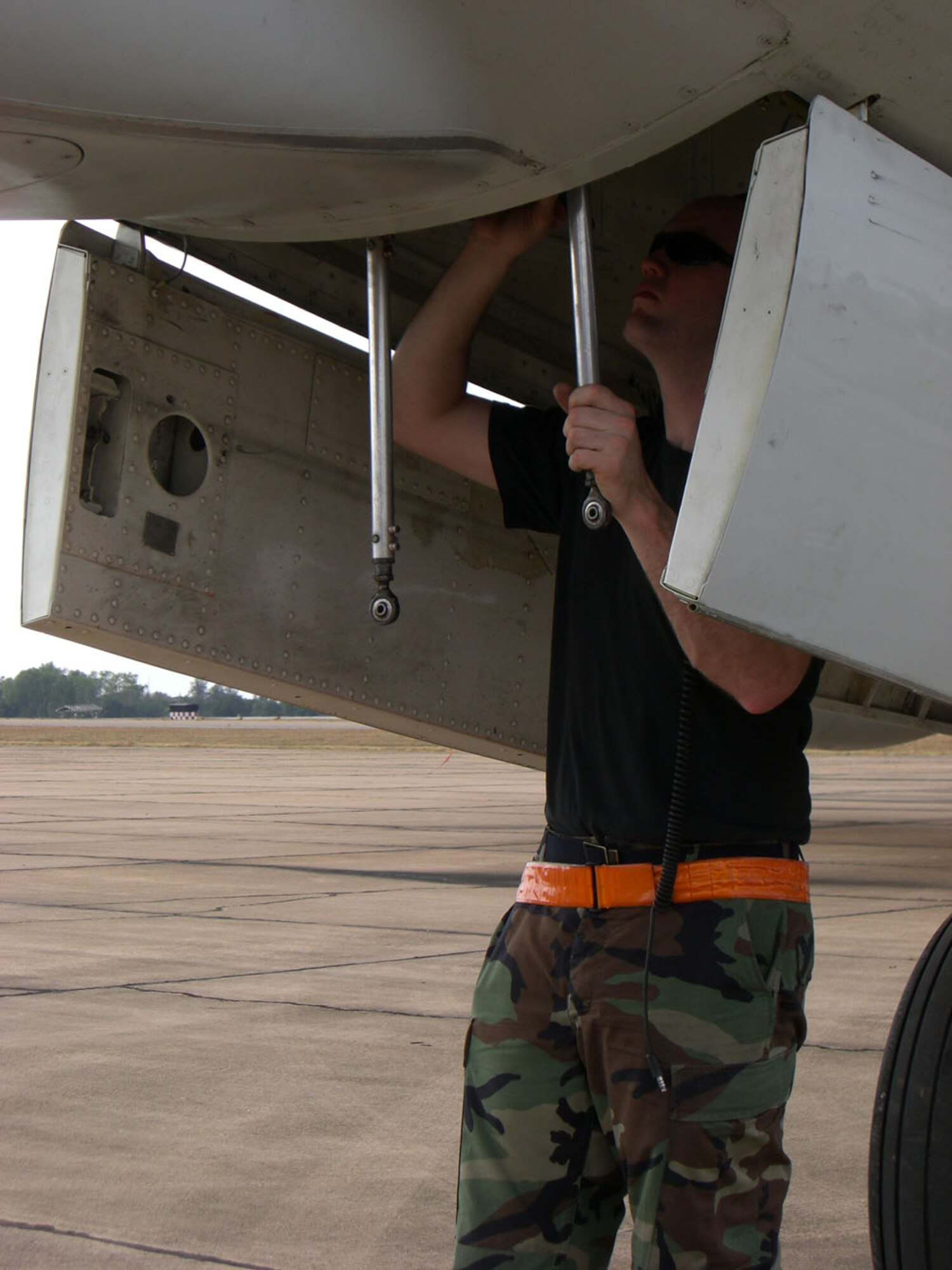 KORAT ROYAL THAI AIR BASE, Thailand – A maintainer from the 961st Expeditionary Airborne Air Control Squadron conducts post flight inspections and servicing on the E-3 Sentry AWACS upon arrival here from Kadena Air Base, Japan, Jan. 24.  The 36-member team on the aircraft included crew members, maintainers, and security forces from Kadena and Elmendorf Air Force Base, Alaska. The Airmen are here for Exercise Cope Tiger '08, a Thai- and U.S.-sponsored multilateral joint and combined field training exercise, and humanitarian/civic assistance exercise. Cope Tiger enhances combined readiness and interoperability, reinforces U.S. commitment to the Southeast Asian region, and demonstrates our capability to project combined and joint forces strategically in a multilateral environment.  (U.S. Air Force photo by Capt. Renee Lee)

