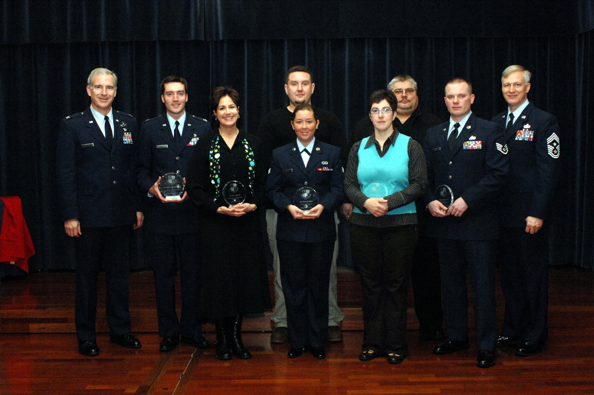 SPANGDAHLEM AIR BASE, Germany – Col. Thomas Feldhausen, 52nd Fighter Wing vice commander, and Chief Master Sgt. Vance Clark, 52nd FW command chief, recognize the base’s fourth quarter award winners. (U.S. Air Force photo/Airman 1st Class Jenifer Calhoun)