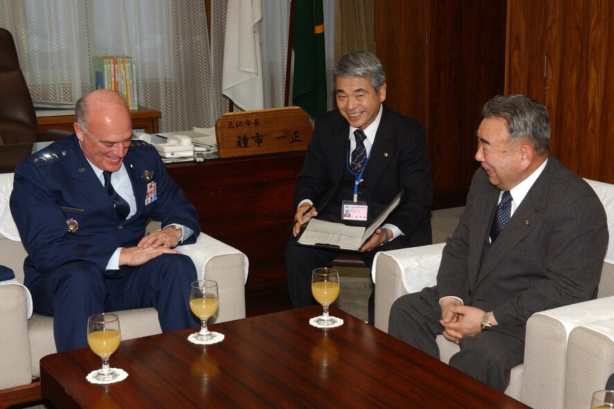 MISAWA AIR BASE, Japan -- Gen. Howie Chandler (left), Pacific Air Forces commander, jokes with Misawa City Mayor Kazumasa Taneichi (right), and Yukio Yamahata (center), Mayor Taneichi's interpreter, here Jan. 24, 2008.  General Chandler assumed command of the Pacific Air Forces in November 2007.  (U.S. Air Force photo by Senior Airman Robert Barnett)