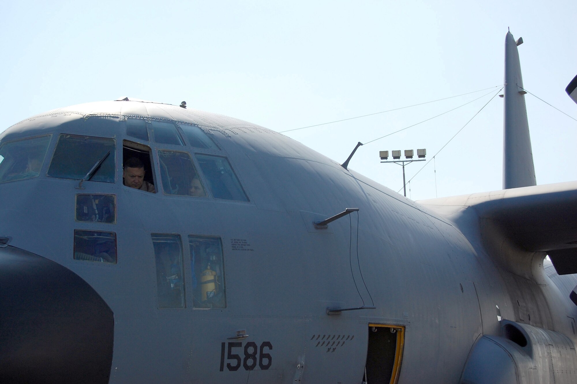 Lt. Gen. Gary L. North, 9th Air Force and Central Command Air Forces commander gets acquainted with the EC-130H Compass Call by Airmen from the 43rd Expeditionary Electronic Combat Squadron Jan. 24 at a flight line in the Persian Gulf.  The E-C130H Compass Call system employs offensive counterinformation and electronic attack capabilities supporting U.S. and Coalition tactical air, surface, and special operations forces. (U.S. Air Force photo/ Capt. Jason McCree) 
