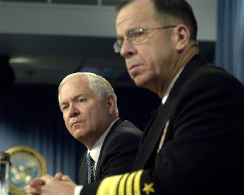 Secretary of Defense Robert M. Gates (left) and Chairman of the Joint Chiefs of Staff Adm. Mike Mullen (right), U.S. Navy, listen to a reporter's question during a media availability in the Pentagon on Jan. 24, 2008.  