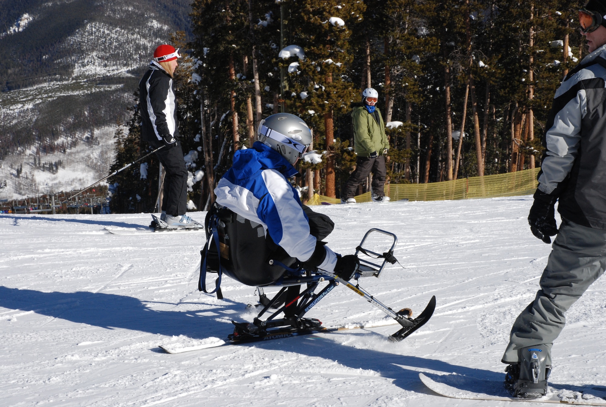 Airman 1st Class Kevin Krogh takes offdown the mountain at Keystone, Colo., Jan. 26. Airman Krogh, who was injured during an automobile accident, is an F-22 Raptor weapons loaders assigned to Langley AFB, Va. Airman Krogh was one several disabled servicemembers who took advantage of Adaptive Adventures, Inc., and the free ski lessons they offered during the annual SnoFest military community event in Keystone, Colo. (U.S. Air Force photo/Senior Airman Stephen Collier)