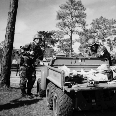 Master Sgt. Michael Hoover, right, prepares to do some electrical work during the Silver Flag exercise at Tyndall Air Force Base, Fla.  Twenty-eight Reservists from the 446th Civil Engineer Squadron participated in Silver Flag Jan. 6-11.  Silver Flag is a wartime training exercise.