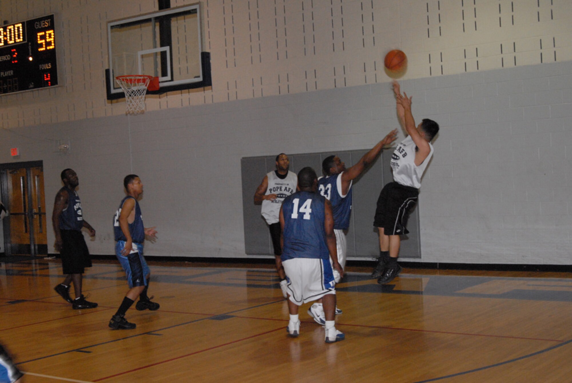 Marvin Villegas, 3rd Aerial Port Squadron (2), takes a fadeaway jump shot over a 43rd LRS defender. 3rd APS was never in the game, as 43rd LRS got out to a huge lead and never looked back in a 70-31 win. It was the second blowout win this season for 43rd LRS, which defeated 3rd APS (1) 65-17 Jan. 10. 