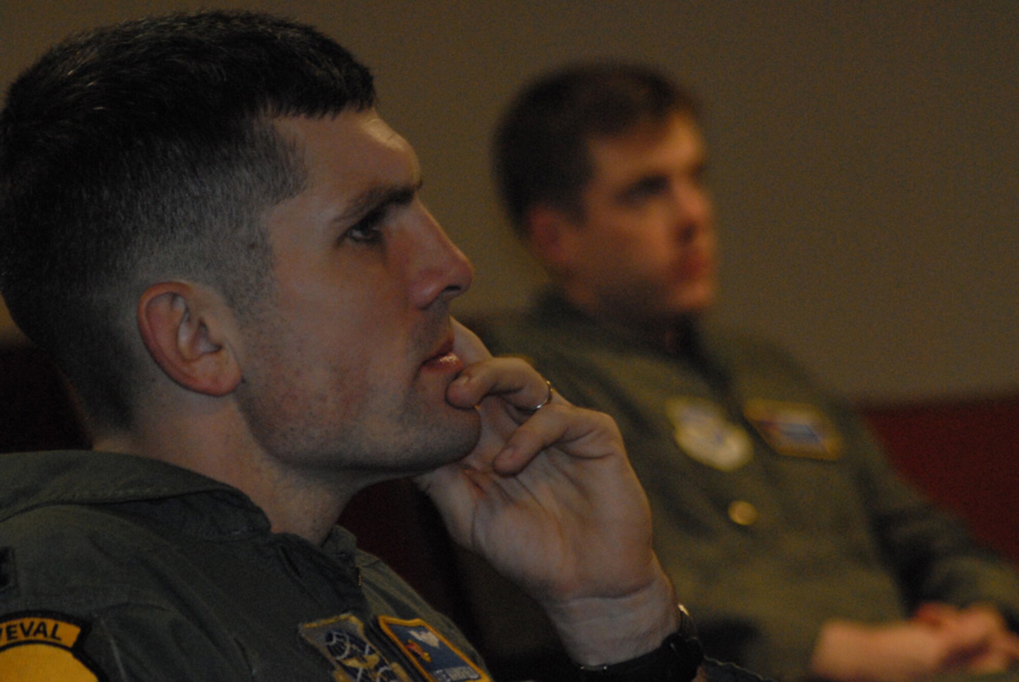 Capt. Nathan Mansfield, 2nd Airlift Squadron, listens as Col. Merle Hart, 440th Airlift Wing Commander, briefs the squadron Jan. 17 about what to expect from the ongoing Base Realignment and Closure transition. 