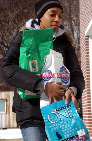 Airman 1st Class Aqueelah Elliott, 51st Logistics Readiness Squadron, carries supplies into the Boeun animal shelter during a volunteer visit Jan. 26. Approximately 15 visited the Korean Animal Protection Society’s Boeun facility to take much needed supplies and food for the approximately 40 animals currently at the shelter. (U.S. Air Force photo/Tech. Sgt. Matthew Summers)