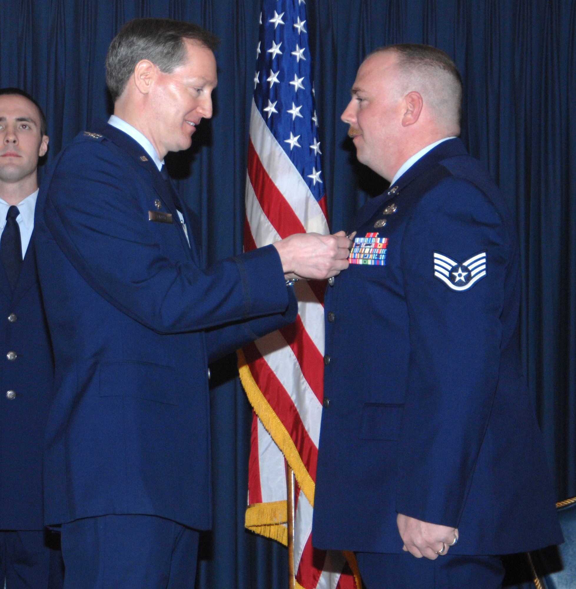 MOUNTAIN HOME AIR FORCE BASE, Idaho -- Left, Col. Thomas Laffey, 366th Mission Support Group commander, presents an Air Force Combat Action Medal to Staff Sgt. Michael Pray, 366th Civil Engineer Squadron, for actions in support of Operation Iraqi Freedom during an awards ceremony at the Gunfighter Club Jan. 25. On June 11, 2006, Sergeant Pray was engaged by the enemy through an improvised explosive device. Following the blast, the sergeant performed an assessment for injuries and ascertained vehicle operability. Approved on March 15, 2007, the medal recognizes Airmen who actively participated in combat. (U.S. Air Force photo/Airman 1st Class Stephany Miller)