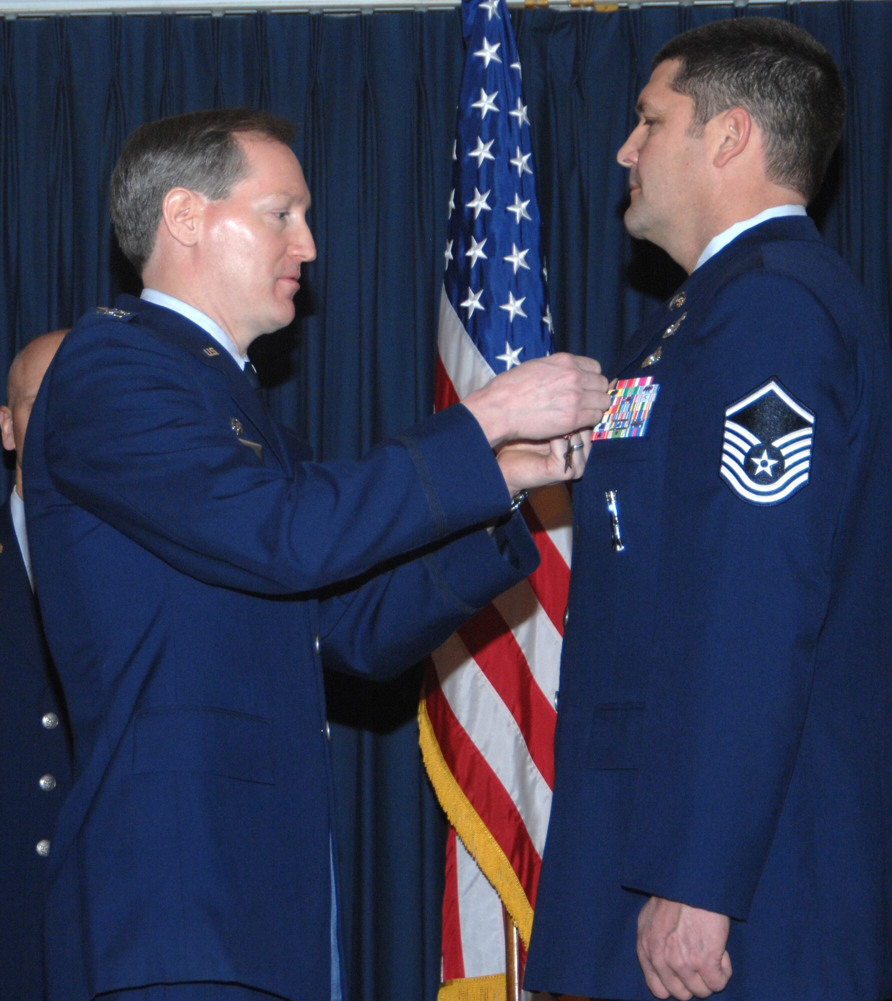 MOUNTAIN HOME AIR FORCE BASE, Idaho -- Left, Col. Thomas Laffey, 366th Mission Support Group commander, presents a Bronze Star Medal to Master Sgt. Michael Bernard, 366th Civil Engineer Squadron, for actions in support of Operation Iraqi Freedom from Jan. 12 to July 1, 2007, during an awards ceremony at the Gunfighter Club Jan. 25. Sergeant Bernard distinguished himself by exceptionally meritorious conduct in performance of outstanding service to the U.S. as part of the explosive ordnance disposal flight, 447th Expeditionary Civil Engineer Squadron, Sather AB, Iraq, from Jan. 13 to July 1, 2007. First authorized on Feb. 4, 1944, to recognize ground troops, the bronze star is the fourth highest award for bravery, heroism or meritorious service. (U.S. Air Force photo/Airman 1st Class Stephany Miller)

