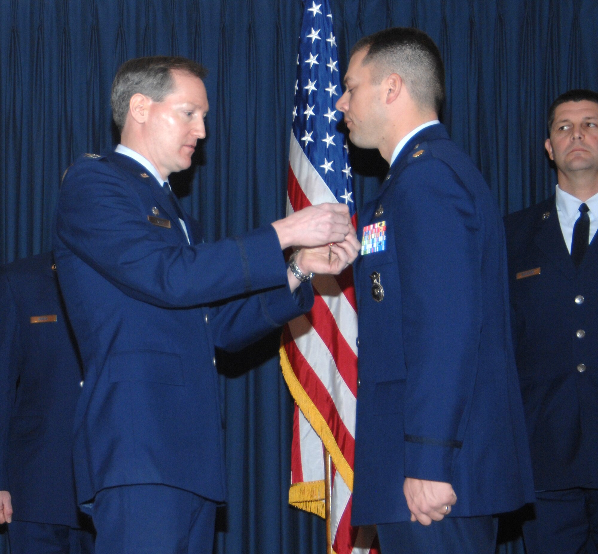 MOUNTAIN HOME AIR FORCE BASE, Idaho -- Left, Col. Thomas Laffey, 366th Mission Support Group commander, presents a Bronze Star Medal to Maj. Matthew Boschert, 366th Security Forces Squadron, for actions in support of Operation Iraqi Freedom from Dec. 7 to June 7, 2007, during an awards ceremony at the Gunfighter Club Jan. 25. As provost marshal for the 148th Brigade Combat Team, 25th Infantry Division, Major Boschert demonstrated outstanding skill, knowledge and leadership in directing law and order operations on the largest coalition forces base in Multinational Division North Iraq with oversight of more than 15,000 forces and civilians on a 16 square mile installation. First authorized on Feb. 4, 1944, to recognize ground troops, the bronze star is the fourth highest award for bravery, heroism or meritorious service. (U.S. Air Force photo/Airman 1st Class Stephany Miller)
