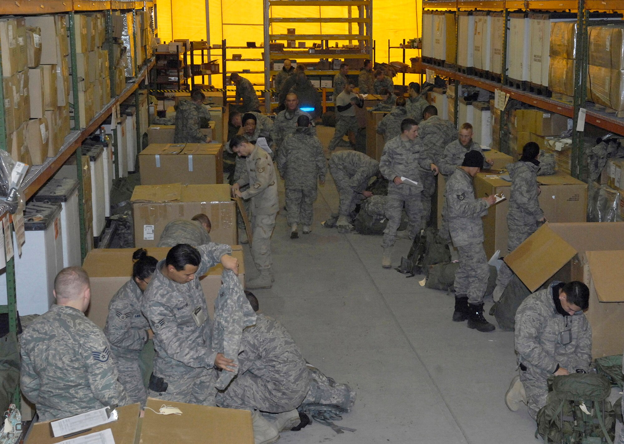 Redeploying Airmen process through the line Jan. 19 at Manas Air Base, Afghanistan. The 156-person team was part of a test for redeploying Airmen serving "in-lieu-of" deployments in Afghanistan (U.S. Air Force photo/Senior Airman Tabitha Kuykendall)
