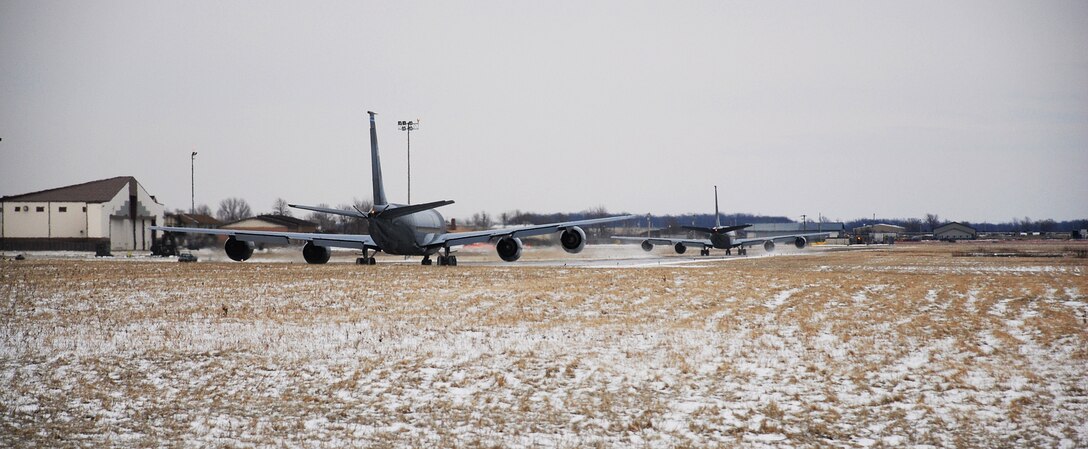 NIAGARA FALLS ARS, N.Y. -- A KC-135 aerial-refueling tanker departs from Niagara Falls Air Reserve Station for the last time Jan. 23. The New York Air National Guard's 107th will change its mission and its aircraft this spring. This is the first of the unit's aircraft to depart following reassignment. The 107th will work alongside the Air Force Reserve's 914th Airlift Wing as part of the Air Force Reserve's "Associate" concept.  In an associate base units will share people, resources and processes to accomplish their flying missions. "Team Niagara" will feature the 914th as host to the 107th this year with both units flying reserve C-130H2s.  (U.S. Air Force photo/Staff Sgt. Dan Lanphear)