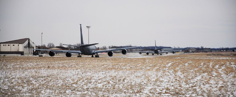 NIAGARA FALLS ARS, N.Y. -- A KC-135 aerial-refueling tanker departs from Niagara Falls Air Reserve Station for the last time Jan. 23. The New York Air National Guard's 107th will change its mission and its aircraft this spring. This is the first of the unit's aircraft to depart following reassignment. The 107th will work alongside the Air Force Reserve's 914th Airlift Wing as part of the Air Force Reserve's "Associate" concept.  In an associate base units will share people, resources and processes to accomplish their flying missions. "Team Niagara" will feature the 914th as host to the 107th this year with both units flying reserve C-130H2s.  (U.S. Air Force photo/Staff Sgt. Dan Lanphear)