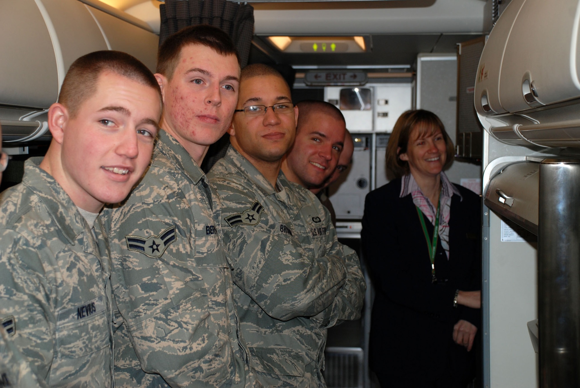Tech. Sgt. April Tarbill (far right), a flight attendant with the 73rd Airlift Squadron, 932nd Airlift Wing, shows off the cooking area on a C-40C and speaks about opportunities in the Air Force Reserve Command flight attendant program.