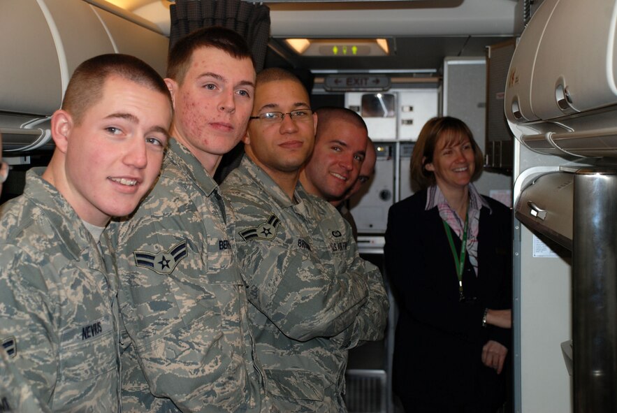 Tech. Sgt. April Tarbill (far right), a flight attendant with the 73rd Airlift Squadron, 932nd Airlift Wing, shows off the cooking area on a C-40C and speaks about opportunities in the Air Force Reserve Command flight attendant program.  Airmen should be five levels in their current position before inquiring about cross training. For more information on joining the Air Force Reserve Command, call 1-800-257-1212. Photo/Capt. Stan Paregien