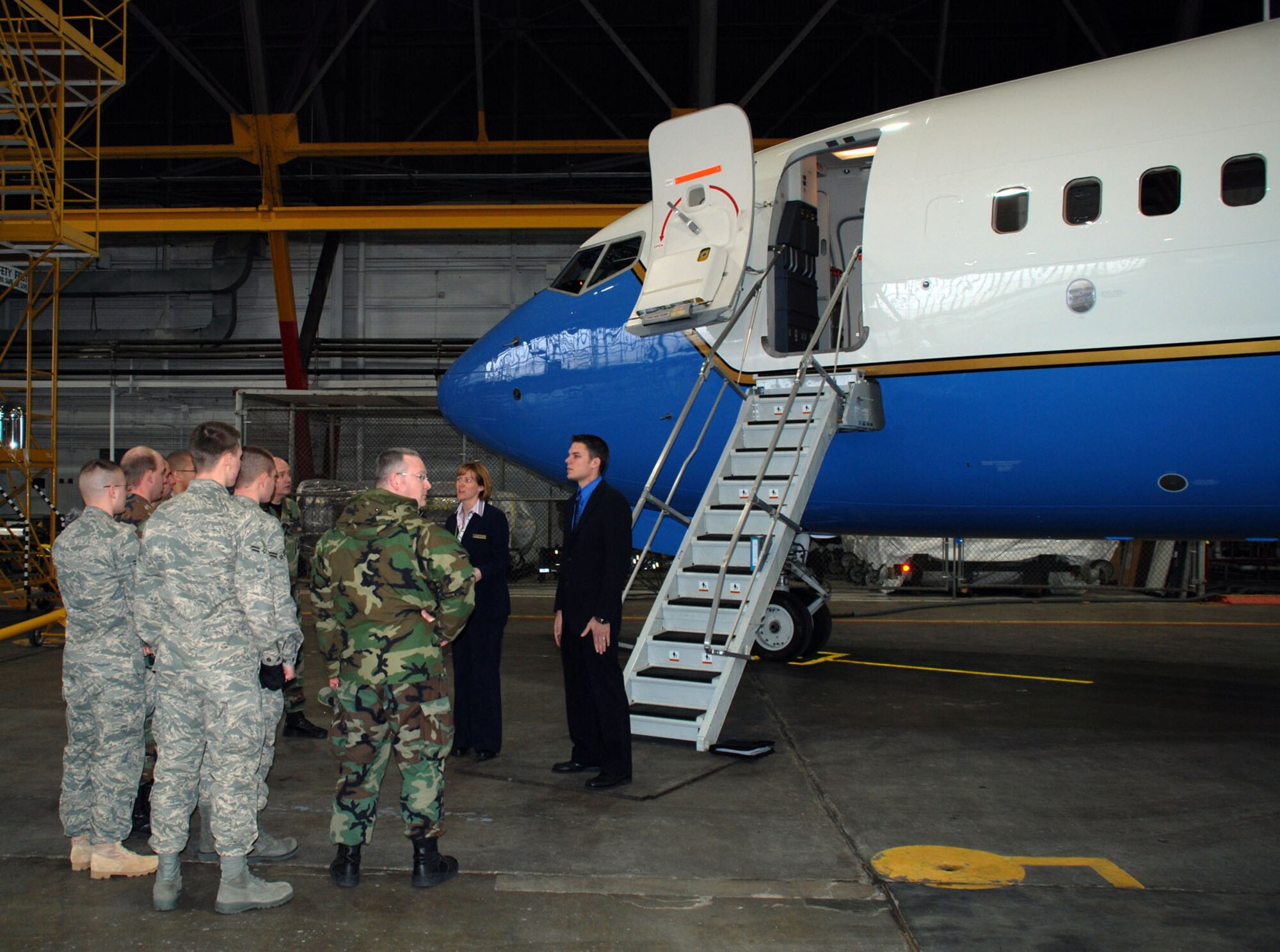 Tech. Sgt. April Tarbill and Senior Airman Bob Fourman, both flight attendants with the 73rd Airlift Squadron, 932nd Airlift Wing, speak to active duty about opportunities in the Air Force Reserve Command flight attendant program.  Military members must have a five level and qualify for a top secret clearance.  For more information on the Air Force Reserve, call 1-800-257-1212.  Photo/Capt. Stan Paregien