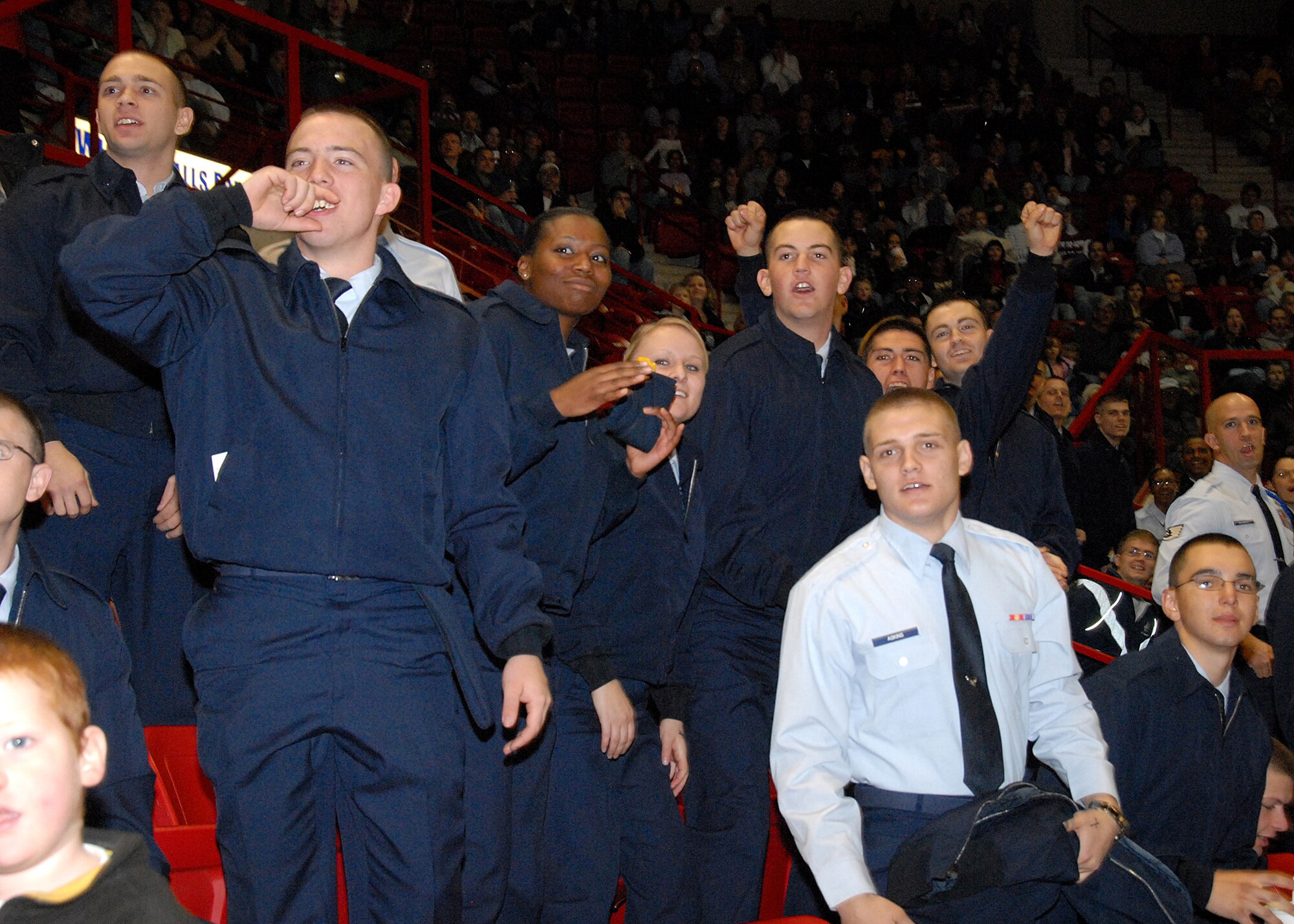 Airmen in Training from Sheppard Air Force Base, Texas, react to action on the ice Jan. 26 during a military appreciation hockey game between the Wichita Falls Wildcats and the Fairbanks Ice Dogs. More than 400 AiTs and thousands of other Team Sheppard personnel filled the seats during the annual military honor. Fairbanks won the contest, 4-3. (U.S. Air Force photo/Mike Litteken)