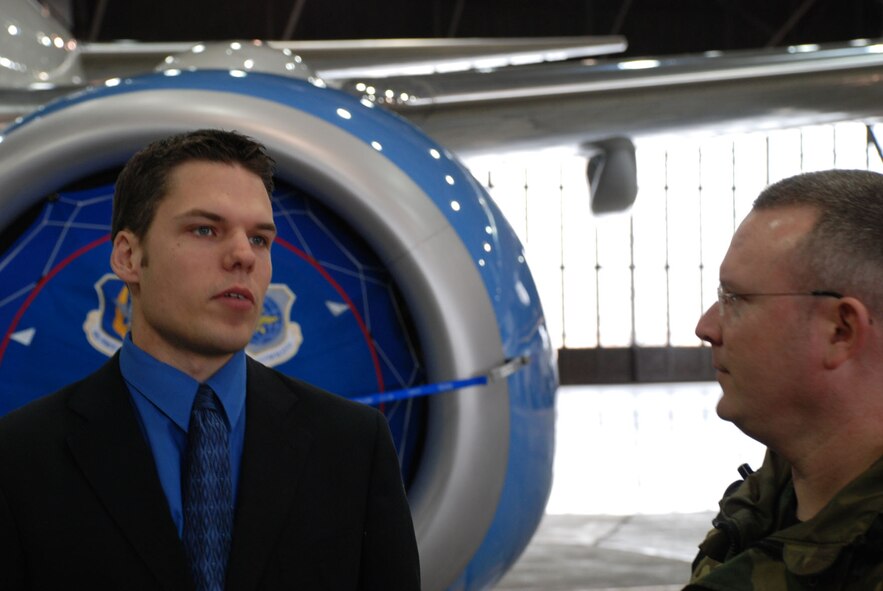 Senior Airman Bob Fourman, a flight attendant with the 73rd Airlift Squadron, 932nd Airlift Wing, speaks with a sergeant about opportunities in the flight attendant program.  For more information on the Air Force Reserve, call 1-800-257-1212.