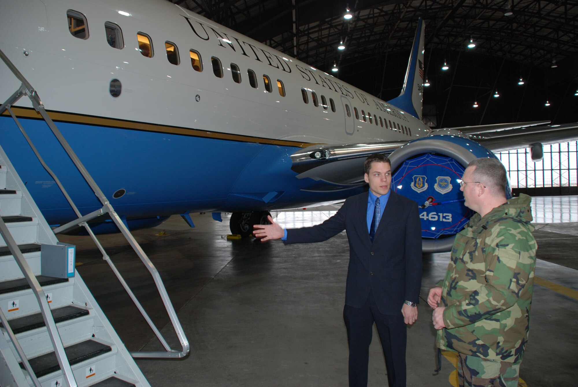 Senior Airman Bob Fourman, a flight attendant with the 73rd Airlift Squadron, 932nd Airlift Wing, speaks with a sergeant about opportunities in the flight attendant program.  Airmen should be 5 levels in their current position before inquiring about cross training.  Photo/Capt. Stan Paregien