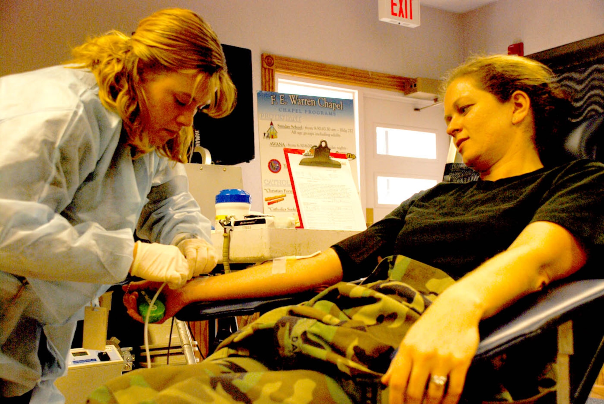 Capt. Mary Danner, 90th Space Wing chief of Public Affairs, donates blood at the 90th SW blood drive Jan. 18. This is the second time Captain Danner has given blood, but the first since her arrival at Warren in December (U.S. Air Force photo/Airman 1st Class Daryl Knee).
