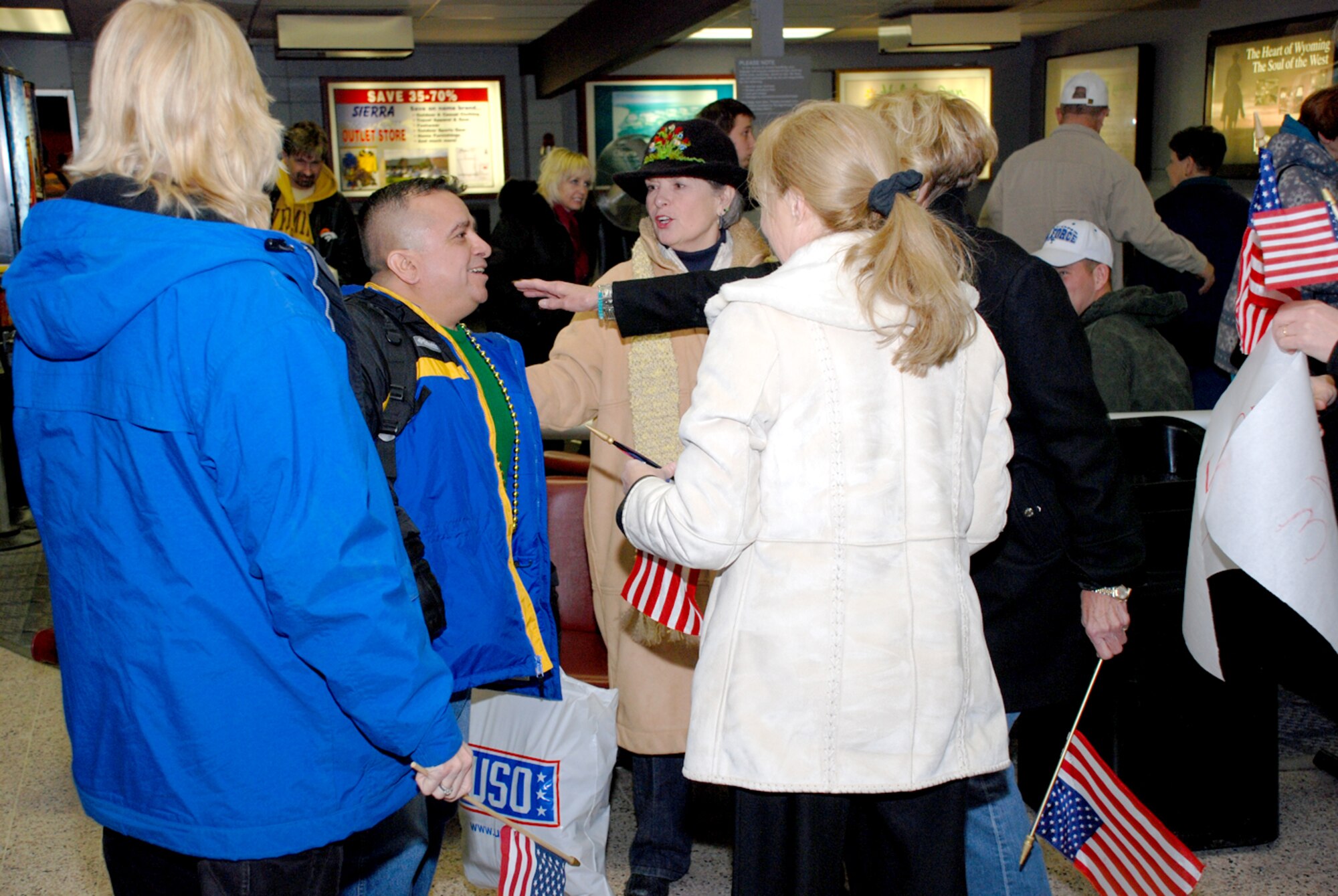 Master Sgt. Mike Garcia, 90th Logistics Readiness Squadron, returns to Warren Jan. 15 after a deployment to Iraq. Sergeant Garcia was greeted at the Cheyenne Regional Airport by an entourage of family and friends waving American flags (U.S. Air Force photo/Airman 1st Class Daryl Knee).