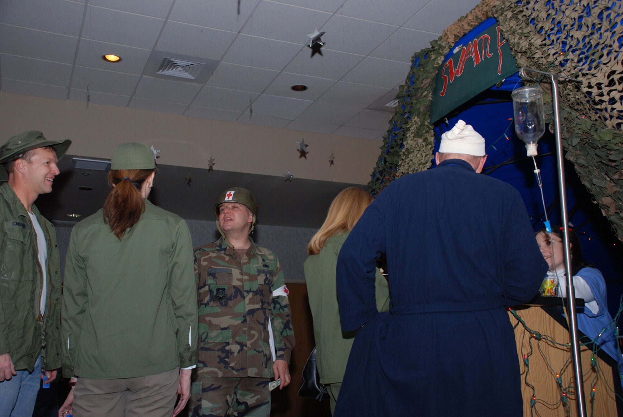 Party goers could buy beverages at the Swamp, a camouflaged bar, with drink tickets. The 90th MDG hosted the party and more than 175 people attended (U.S. Air Force photo/Airman 1st Class Daryl Knee).