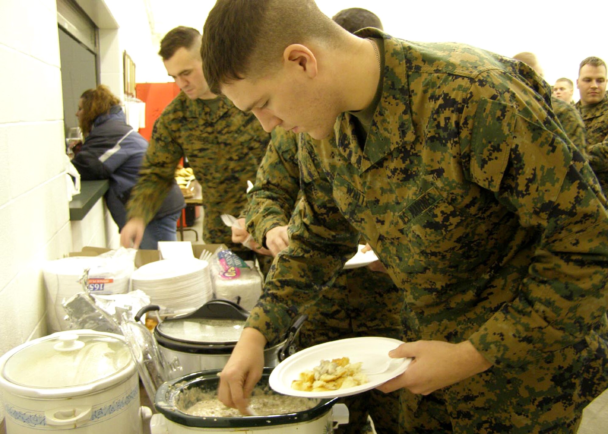 GRISSOM AIR RESERVE BASE, Ind, --  Marines from Det. 1 Communications Company here, dig into a breakfast to benefit one of their members who lost a child recently. Norah Follrod, 2, daughter of Cpl. David and Melyssa Follrod of Fort Wayne, Ind., died in early January. The Marines from Grissom raised more than $2,200 to help offset some of the medical costs incurred by the Follrod family. (U.S. Marine Corps photo) 