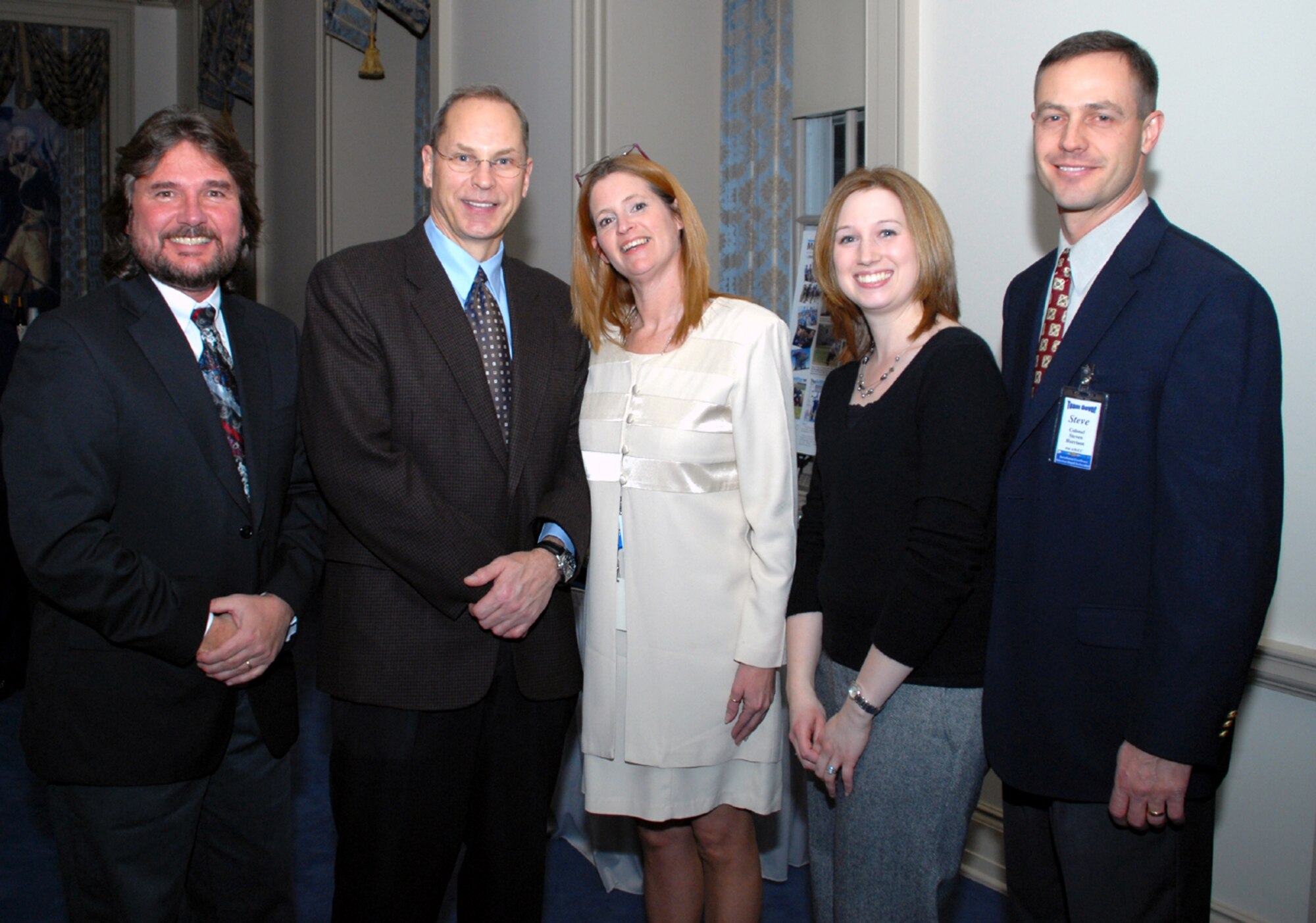 Russ McCabe, Delaware Public Archives director and state archivist, Maj. Gen. Mark Anderson, Air Force Commander In Chief's Installation Excellence team leader, Susan Voshell, Delaware Public Archives administrative specialist, Moira Conlan, Delaware Public Archives information resources specialist, and Col. Steven Harrison, 436th Airlift Wing commander, shared compliments at an 'Ice Breaker' held at the Delaware Public Archives in honor of the CINC IE team Jan. 27. (U.S. Air Force photo/Tech. Sgt. Kevin Wallace)