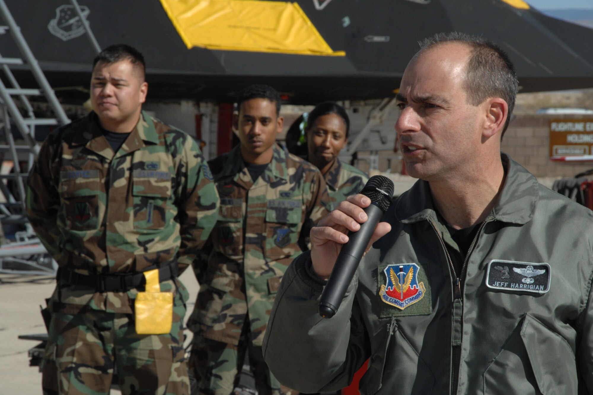 Col. Jeffrey Harrigian gives closing remarks at the F-117 Nighthawk Weapons Load Crew of the Year Competition Jan. 18 at Holloman Air Force Base, N.M. The competition placed the four best weapons load crews (two from the 8th Aircraft Maintenance Unit and two from the 9th Aircraft Maintenence Unit) against each other to determine who the best load crew of the year was. The competition is the last for the F-117 as Holloman AFB is scheduled to retire the aircraft and bring in the F-22 Raptor. Colonel Harrigian is the 49th Fighter Wing commander. (U.S. Air Force photo/Airman 1st Class Jamal D. Sutter) 
