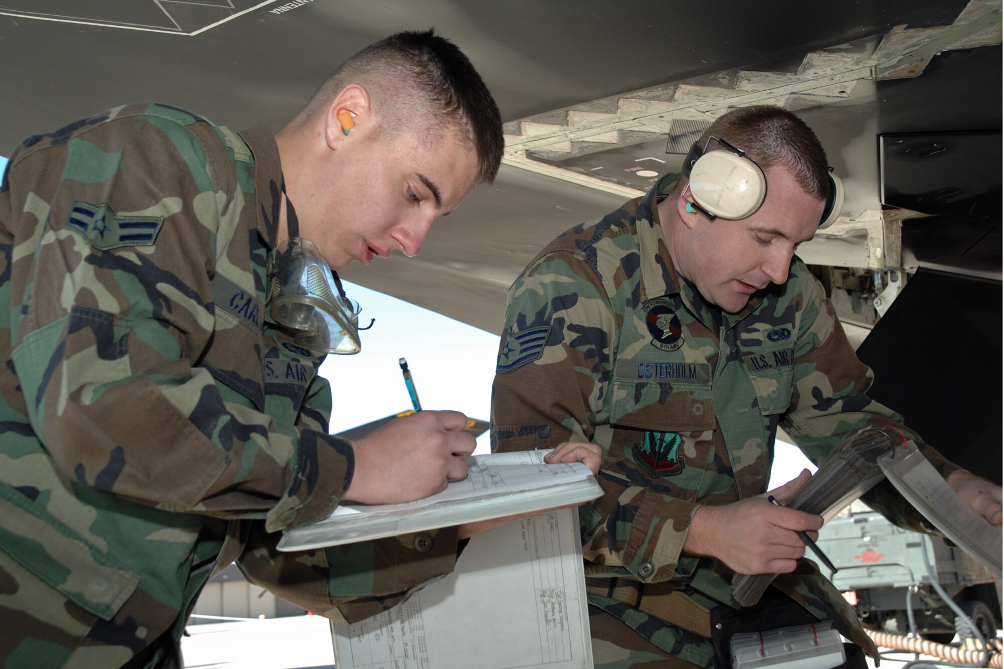 Airman 1st Class Corey Colombari and Staff Sgt. Christopher Osterholm complete a checklist during the F-117 Nighthawk Weapons Load Crew of the Year Competition Jan. 18 at Holloman Air Force Base, N.M. The competition is the last of its kind for the F-117. Airman Colombari and Sergeant Osterholm are assigned to the 49th Maintenance Squadron (U.S. Air Force photo/Airman 1st Class Jamal D. Sutter) 
