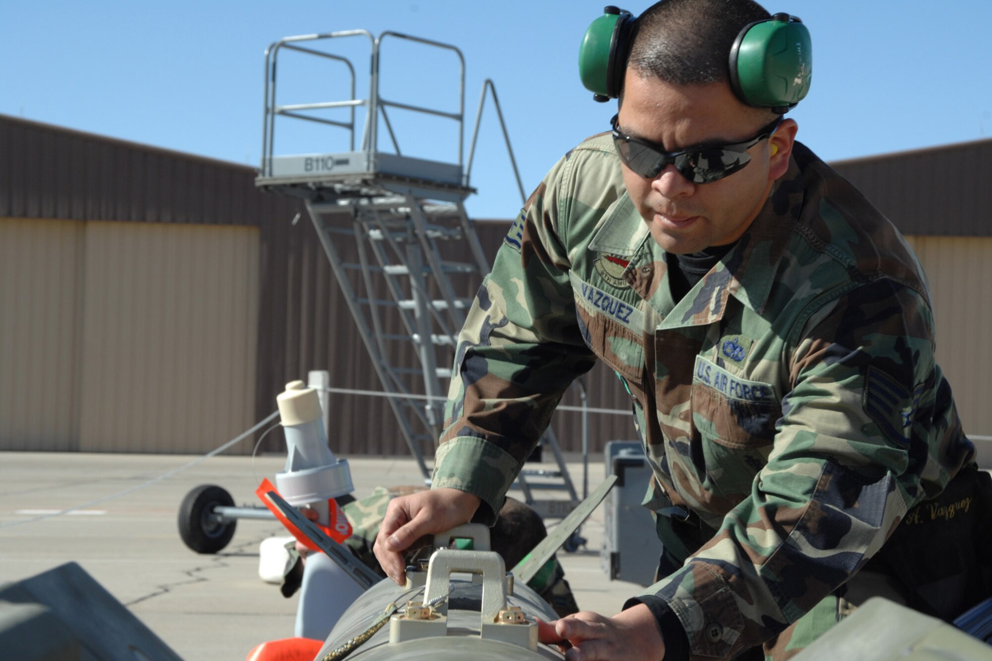 Staff Sgt. Alberto Vazquez preps a guided bomb unit-27 during the F-117 NIghthawk Weapons Load Crew of the Year Competition Jan. 18 at Holloman Air Force Base, N.M. This is the last competition as Holloman AFB is scheduled to retire the F-117 receive the F-22 Raptor. Sergeant Vazquez is assigned to the 49th Aircraft Maintenance Squadron. (U.S. Air Force photo/Airman 1st Class Jamal D. Sutter) 
