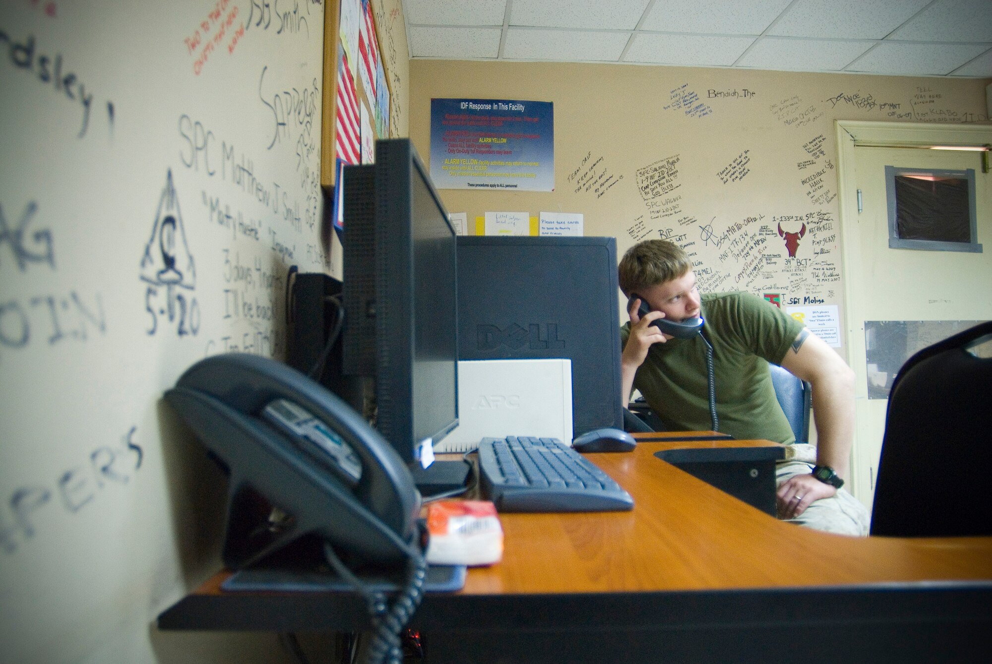 BALAD AIR BASE, Iraq -- Marine Cpl. Trevor S. Horn, an injured member of the 1st Battalion, 11th Marine Regiment, talks to loved ones on the phone at the Contingency Aeromedical Staging Facility here. The CASF provides phones, computers, wireless Internet access, games and movies for patients awaiting transport for follow-on care outside of the combat zone. Corporal Horn is deployed from Camp Pendleton, Calif. (U.S. Air Force photo/ Master Sgt. John Nimmo, Sr.)