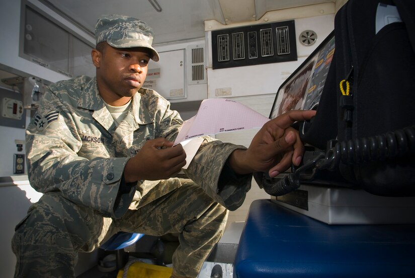 BALAD AIR BASE, Iraq -- Senior Airman Ryan Jackson, an aerospace medical technician at the Contingency Aeromedical Staging Facility, checks an echocardiogram machine in an ambulance here. The machine, commonly known as an EKG, uses ultrasound techniques to provide multi-dimensional imaging of the heart. Airman Jackson is deployed from Langley Air Force Base, Va. (U.S. Air Force photo/ Master Sgt. John Nimmo, Sr.)